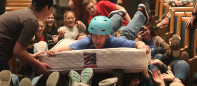 guy with helmet on mattress